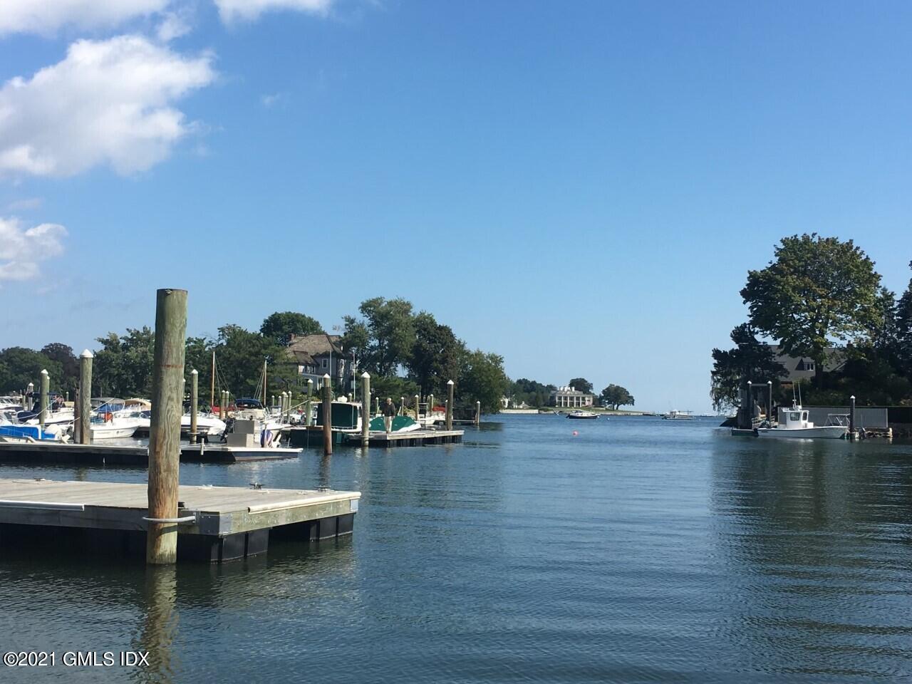 68 Byram Road, Unit 2 Greenwich, CT 06830 - Photo 14 of 20 a view of a lake with boats and trees in the background