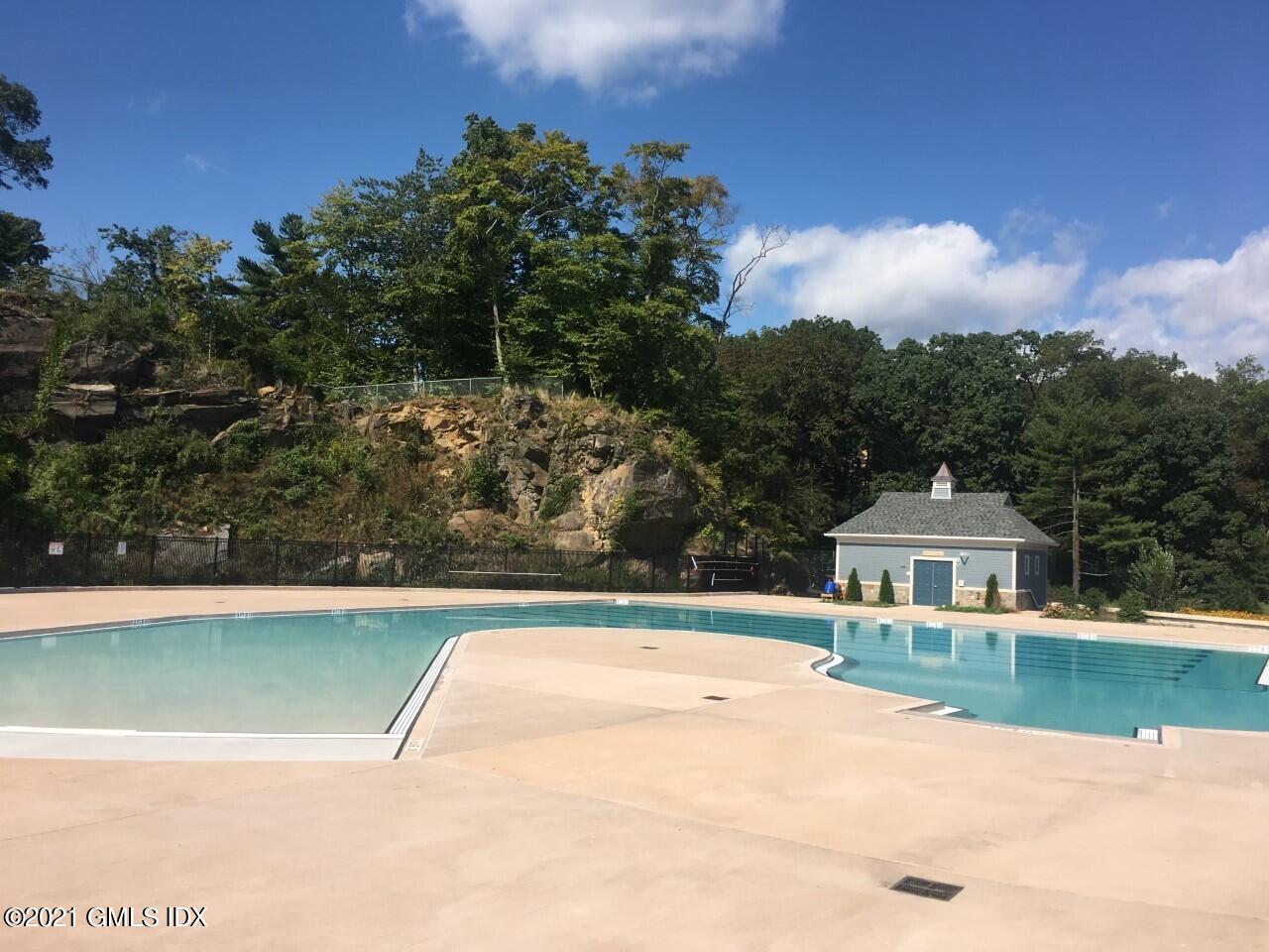 68 Byram Road, Unit 2 Greenwich, CT 06830 - Photo 16 of 20 a front view of a house with a yard