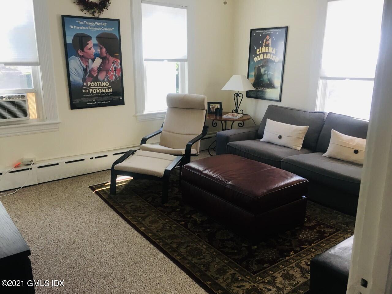 68 Byram Road, Unit 2 Greenwich, CT 06830 - Photo 2 of 20 a living room with furniture and a rug