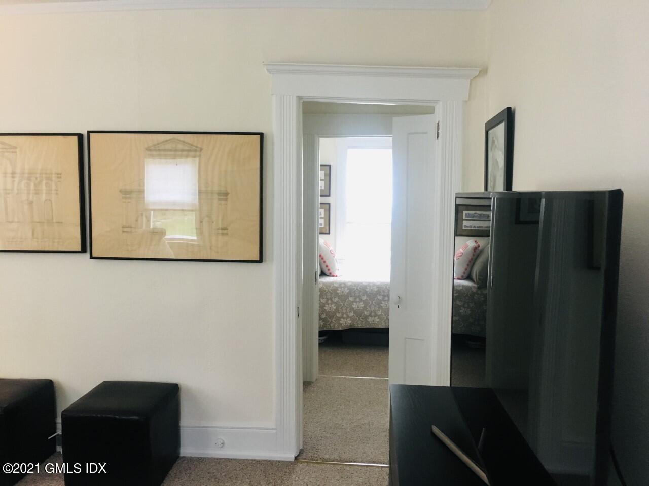 68 Byram Road, Unit 2 Greenwich, CT 06830 - Photo 4 of 20 a en suite bathroom with a sink and a mirror