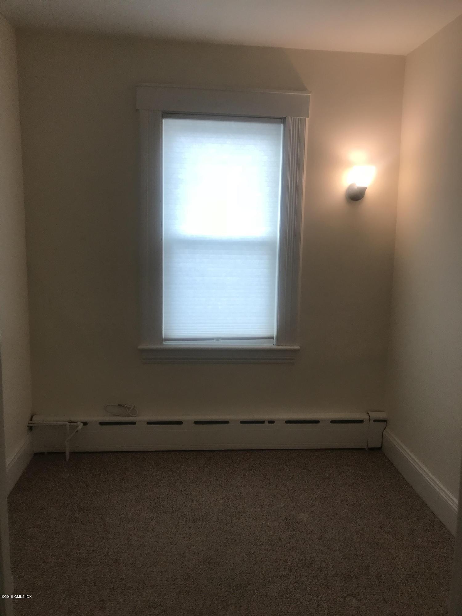 68 Byram Road, Unit 2 Greenwich, CT 06830 - Photo 7 of 20 an empty room with a window