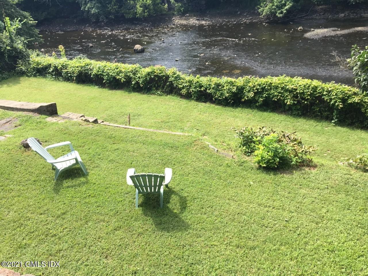 68 Byram Road, Unit 2 Greenwich, CT 06830 - Photo 10 of 20 a view of a lake with a yard