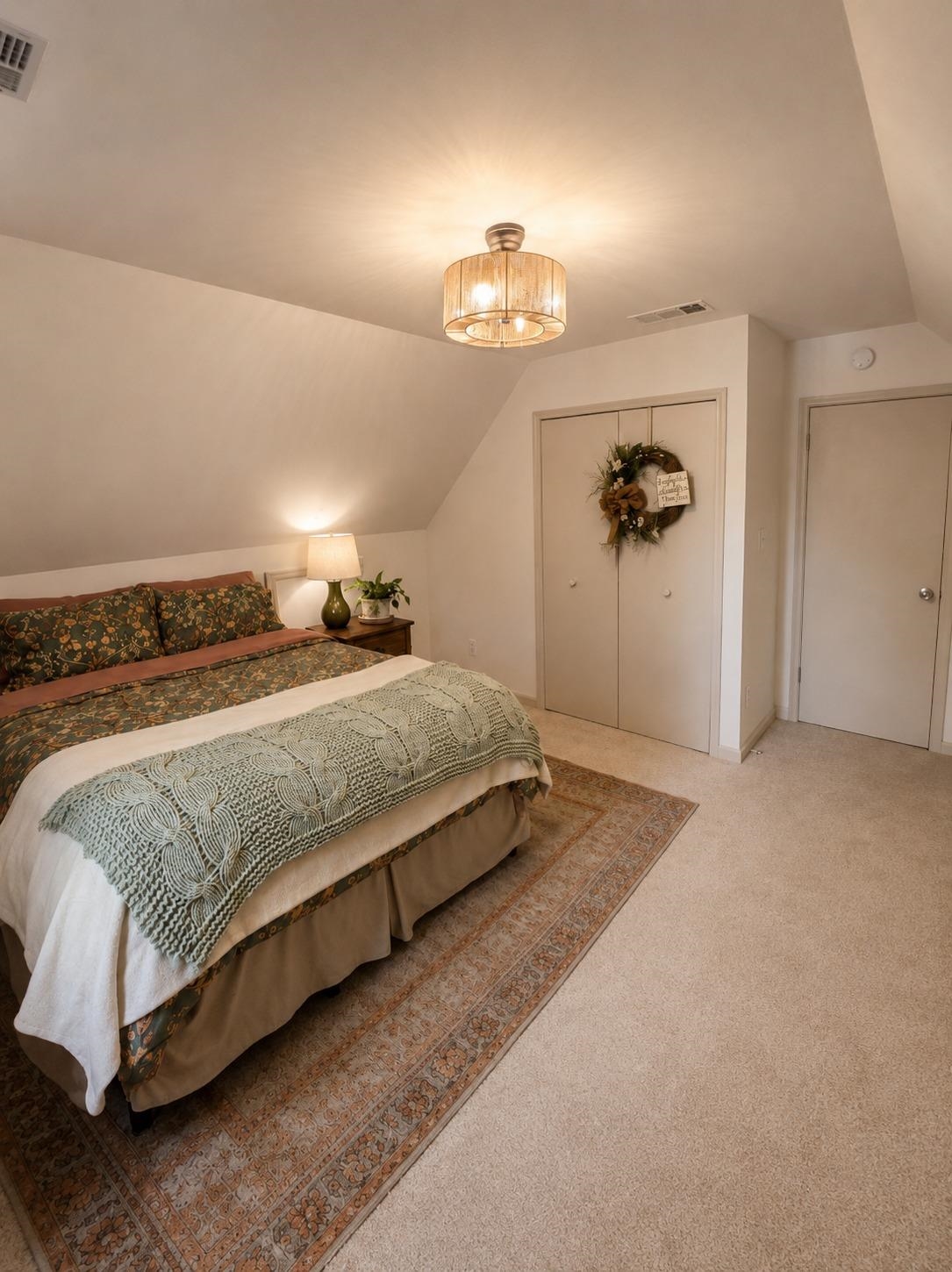 470 Rich Road Somerville, TN 38068 - Photo 36 of 40 Bedroom featuring sloped ceilings, a semi-flush mount ceiling light fixture, neutral carpeting, and bi-fold closet doors