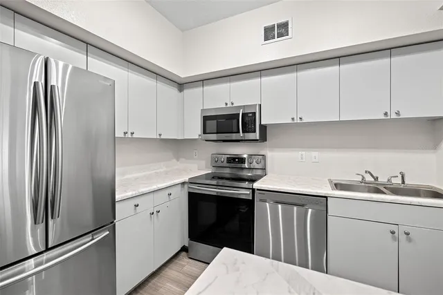 a view of kitchen with wooden floor