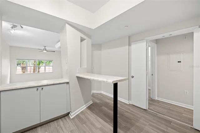 a kitchen with a refrigerator a sink and cabinets