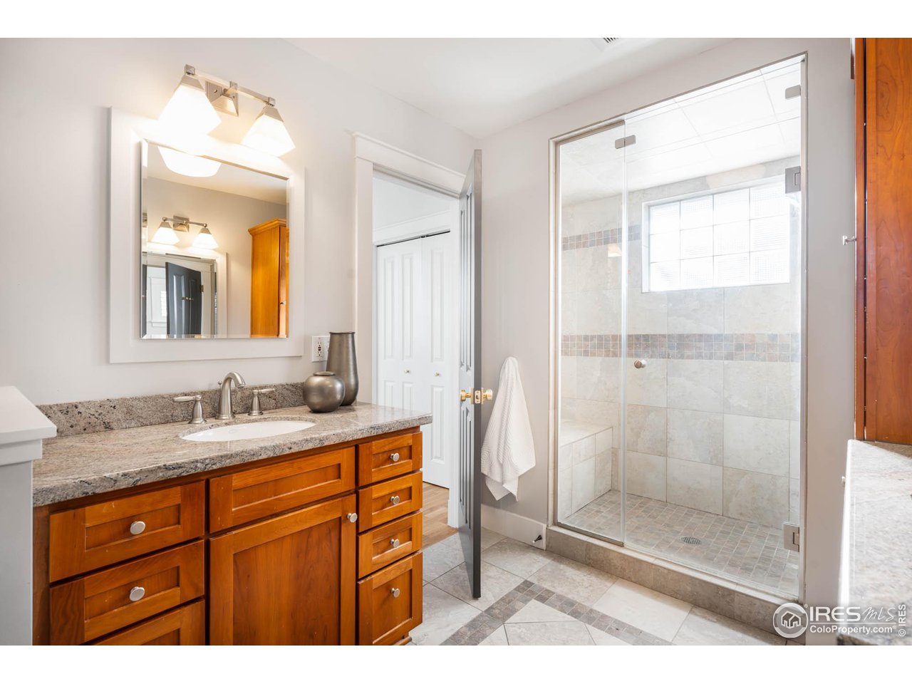 2543 Pine Street Boulder, CO 80302 - Photo 23 of 40 a bathroom with a shower sink and mirror