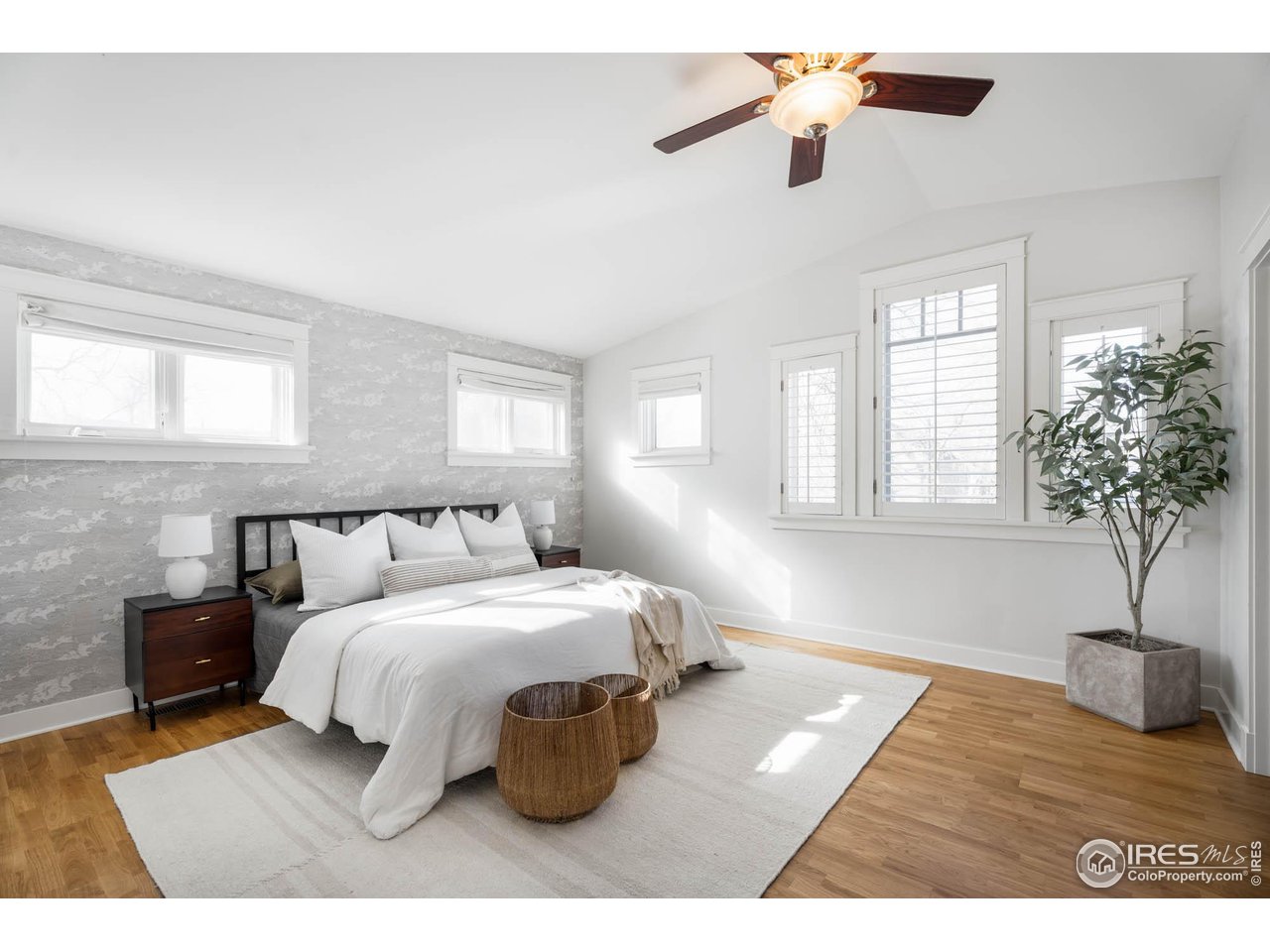 2543 Pine Street Boulder, CO 80302 - Photo 29 of 40 a bedroom with a bed lamp closet and window