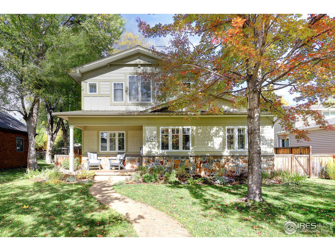 2543 Pine Street Boulder, CO 80302 - Photo 31 of 40 a front view of a house with a yard table and chairs