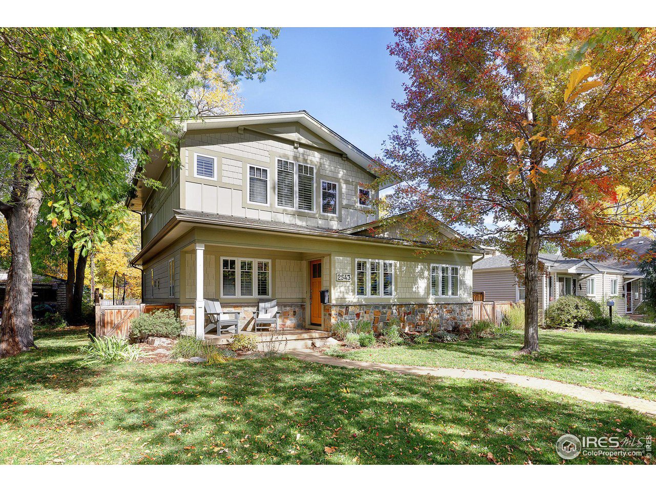 2543 Pine Street Boulder, CO 80302 - Photo 32 of 40 a front view of a house with a garden and trees