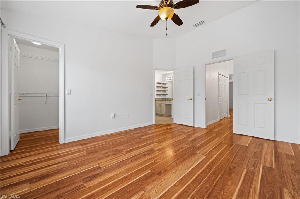 880 Hampton Circle, Unit 160 Naples, FL 34105 - Photo 19 of 32 a view of empty room with wooden floor