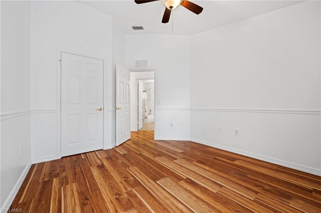 880 Hampton Circle, Unit 160 Naples, FL 34105 - Photo 25 of 32 a view of a room with wooden floor