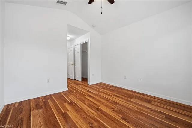 a view of a room with wooden floor