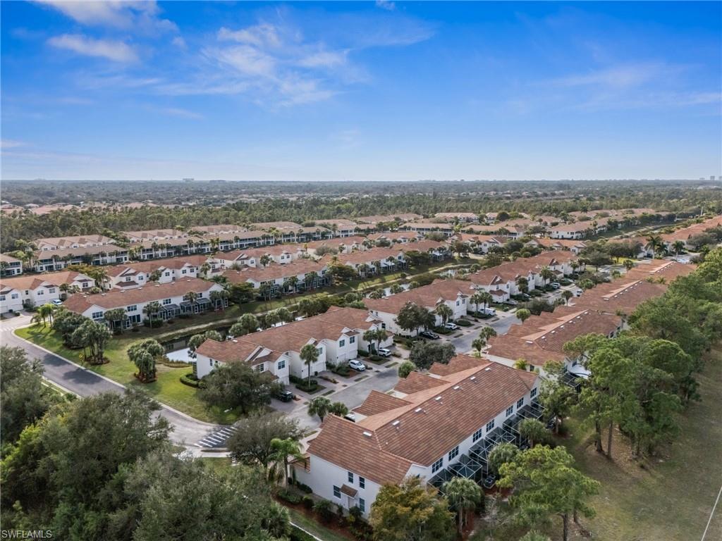 880 Hampton Circle, Unit 160 Naples, FL 34105 - Photo 30 of 32 an aerial view of residential building with green space