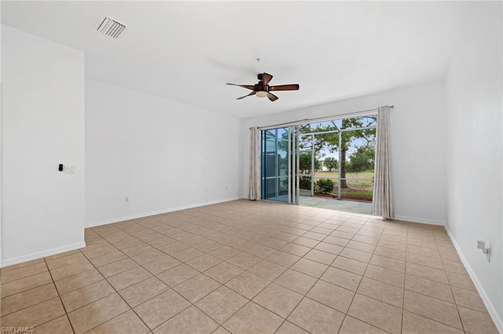 880 Hampton Circle, Unit 160 Naples, FL 34105 - Photo 6 of 32 a view of an empty room with a window