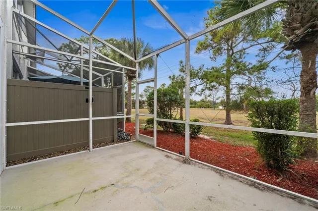 a view of outdoor space with wooden floor and yard in the back