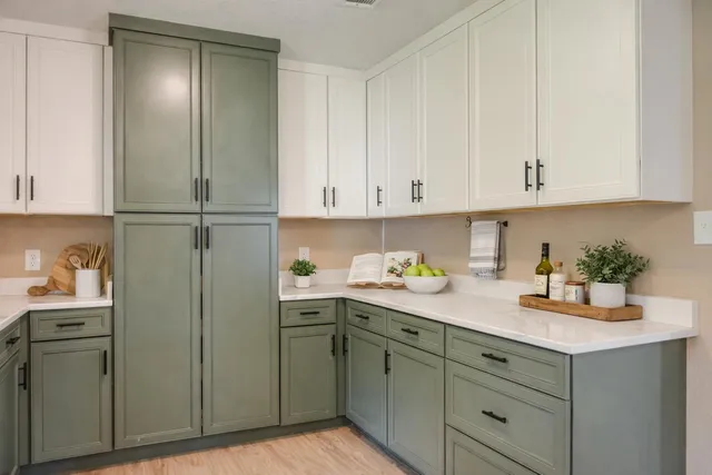 a kitchen with cabinets and appliances