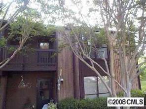1008 Running Ridge Road, Unit 8448 Charlotte, NC 28226 - Photo 1 of 1 a view of a wooden house with a tree