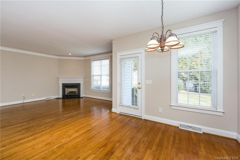 17530 Invermere Avenue Huntersville, NC 28078 - Photo 12 of 36 a view of an empty room with wooden floor and a window