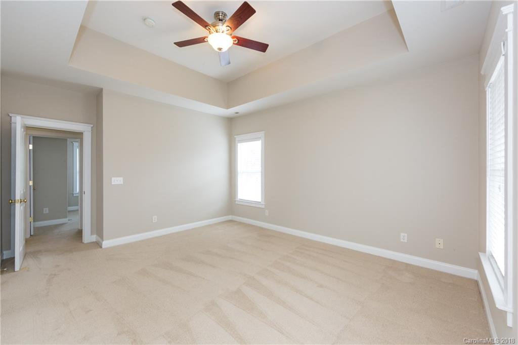 17530 Invermere Avenue Huntersville, NC 28078 - Photo 23 of 36 an empty room with fan and windows