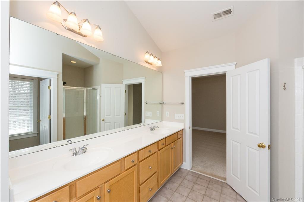 17530 Invermere Avenue Huntersville, NC 28078 - Photo 25 of 36 a bathroom with a double vanity sink and mirror