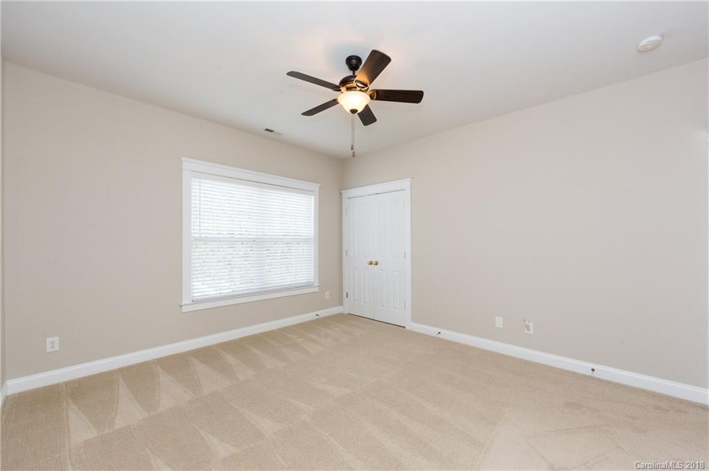 17530 Invermere Avenue Huntersville, NC 28078 - Photo 27 of 36 an empty room with a window and a ceiling fan