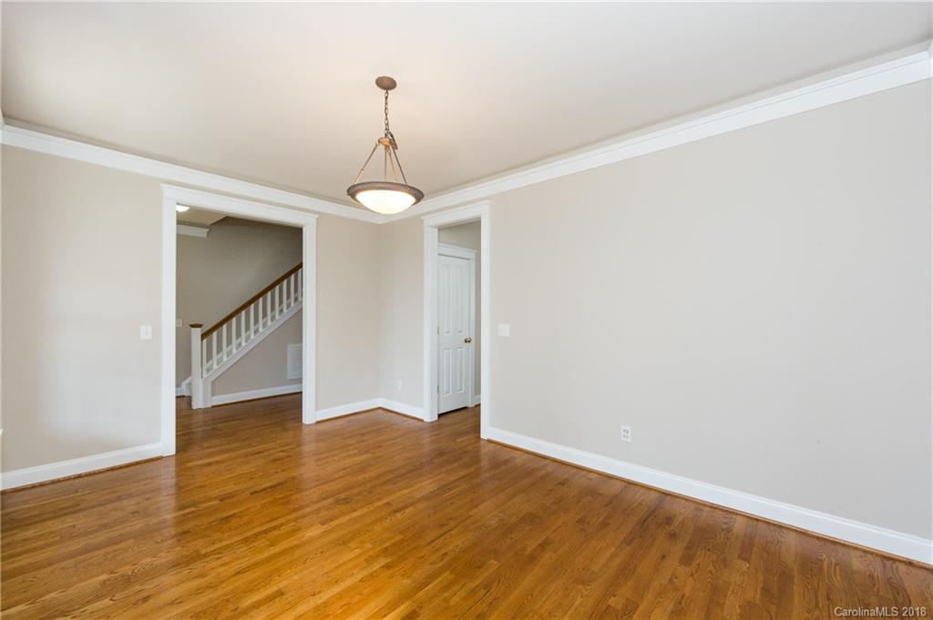17530 Invermere Avenue Huntersville, NC 28078 - Photo 6 of 36 a view of an empty room with wooden floor and a window