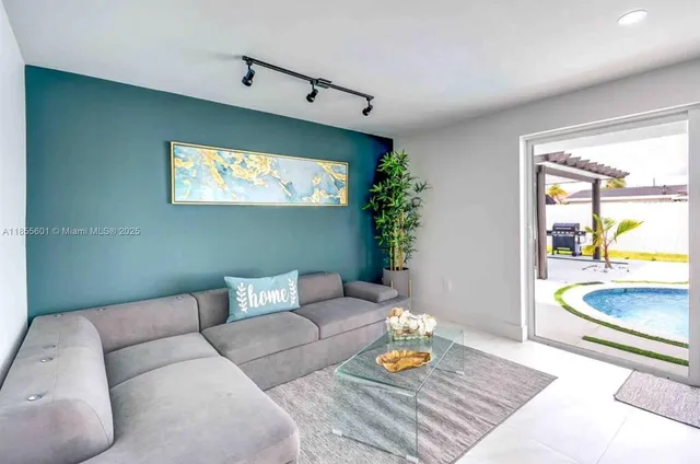 a living room with furniture and a flat screen tv