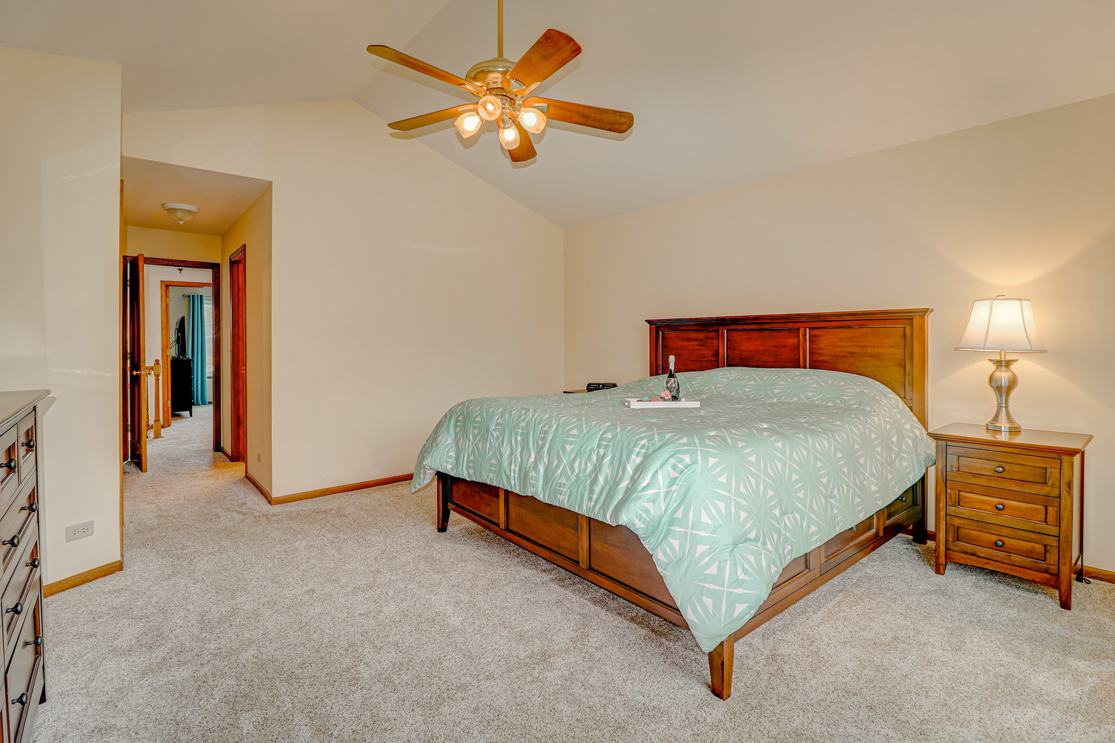 1230 Coldspring Road Elgin, IL 60120 - Photo 14 of 30 a bedroom with a bed and a chandelier