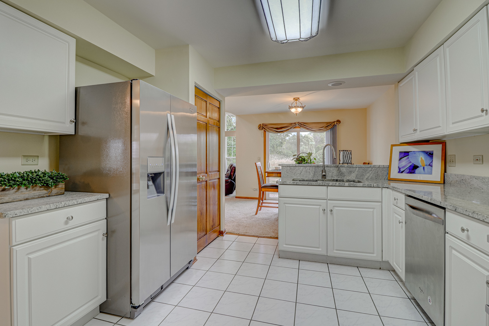1230 Coldspring Road Elgin, IL 60120 - Photo 4 of 30 a kitchen with stainless steel appliances granite countertop a refrigerator and a sink