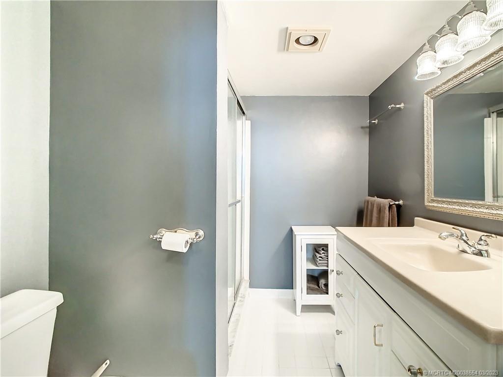 1950 Southwest Palm City Road, Unit 5305 Stuart, FL 34994 - Photo 20 of 29 a bathroom with a sink vanity and a toilet