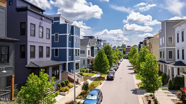 an aerial view of a house with a yard