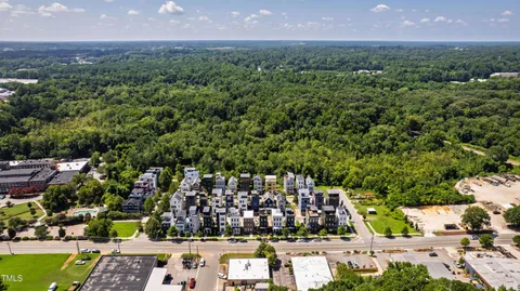 a view of multiple houses with a street