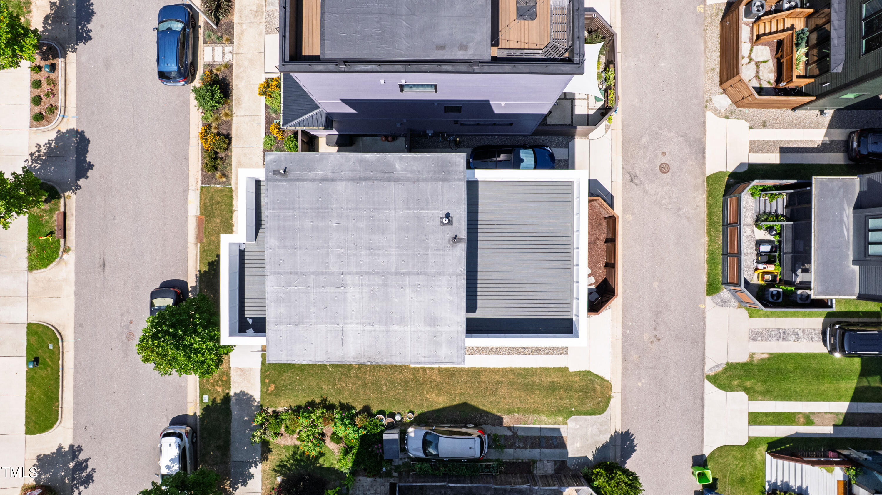 618 Velma Hopkins Lane Raleigh, NC 27603 - Photo 15 of 63 a view of a brick house with many windows and potted plants