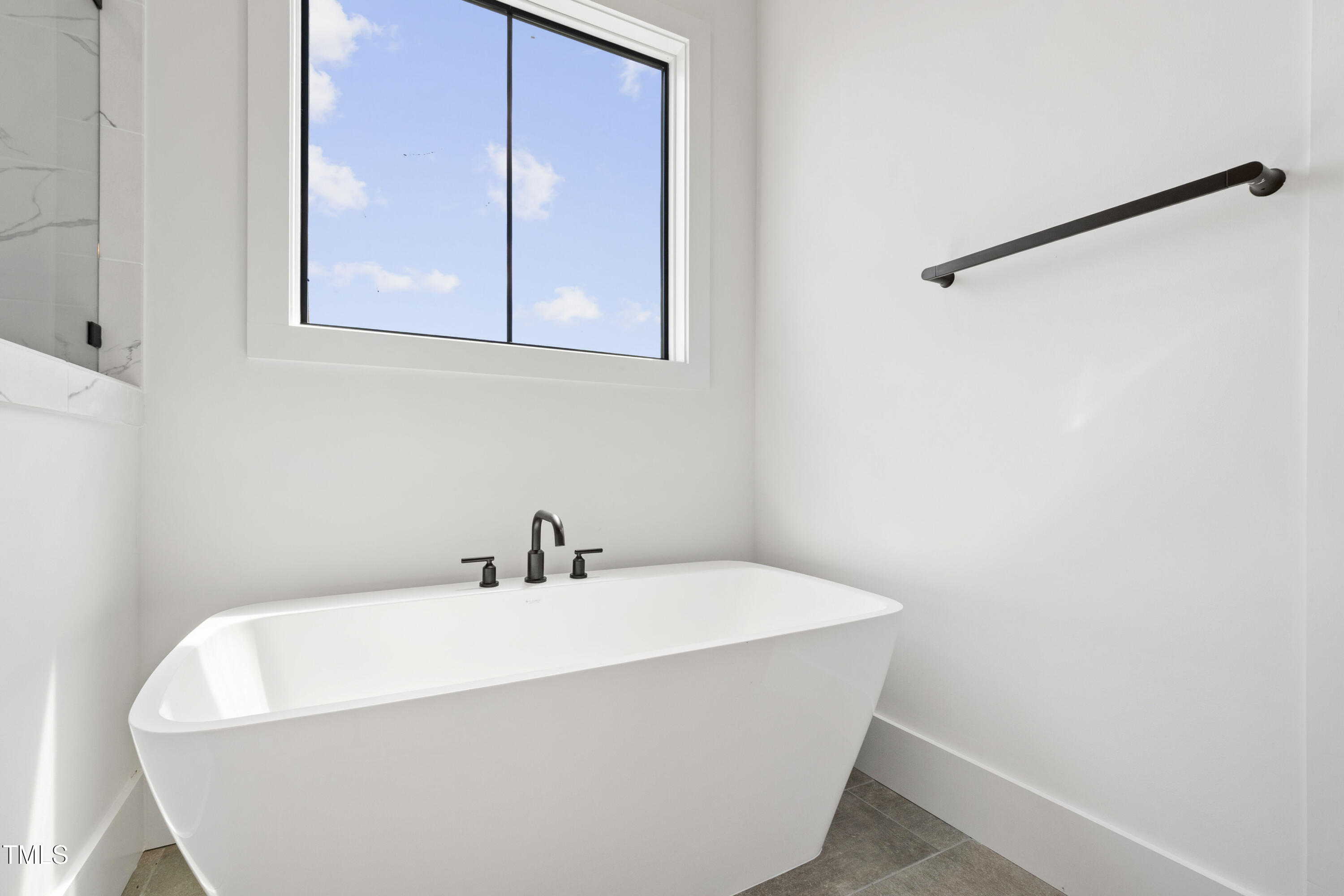 618 Velma Hopkins Lane Raleigh, NC 27603 - Photo 18 of 63 a white bath tub sitting next to a white sink