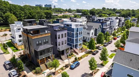 a large kitchen with stainless steel appliances granite countertop a stove and refrigerator