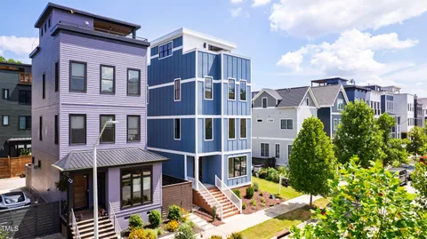 a kitchen with stainless steel appliances granite countertop a sink a stove oven a counter space and cabinets