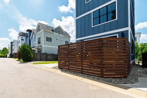 a large kitchen with kitchen island a large counter space and stainless steel appliances
