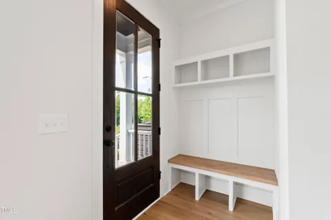 a kitchen with stainless steel appliances granite countertop a sink a stove and a wooden floors