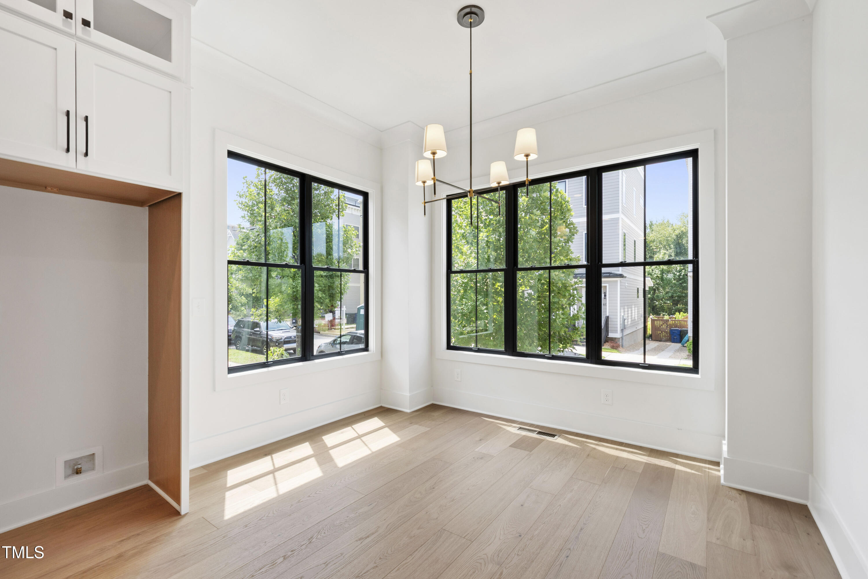 618 Velma Hopkins Lane Raleigh, NC 27603 - Photo 26 of 63 a view of an empty room with a window and wooden floor
