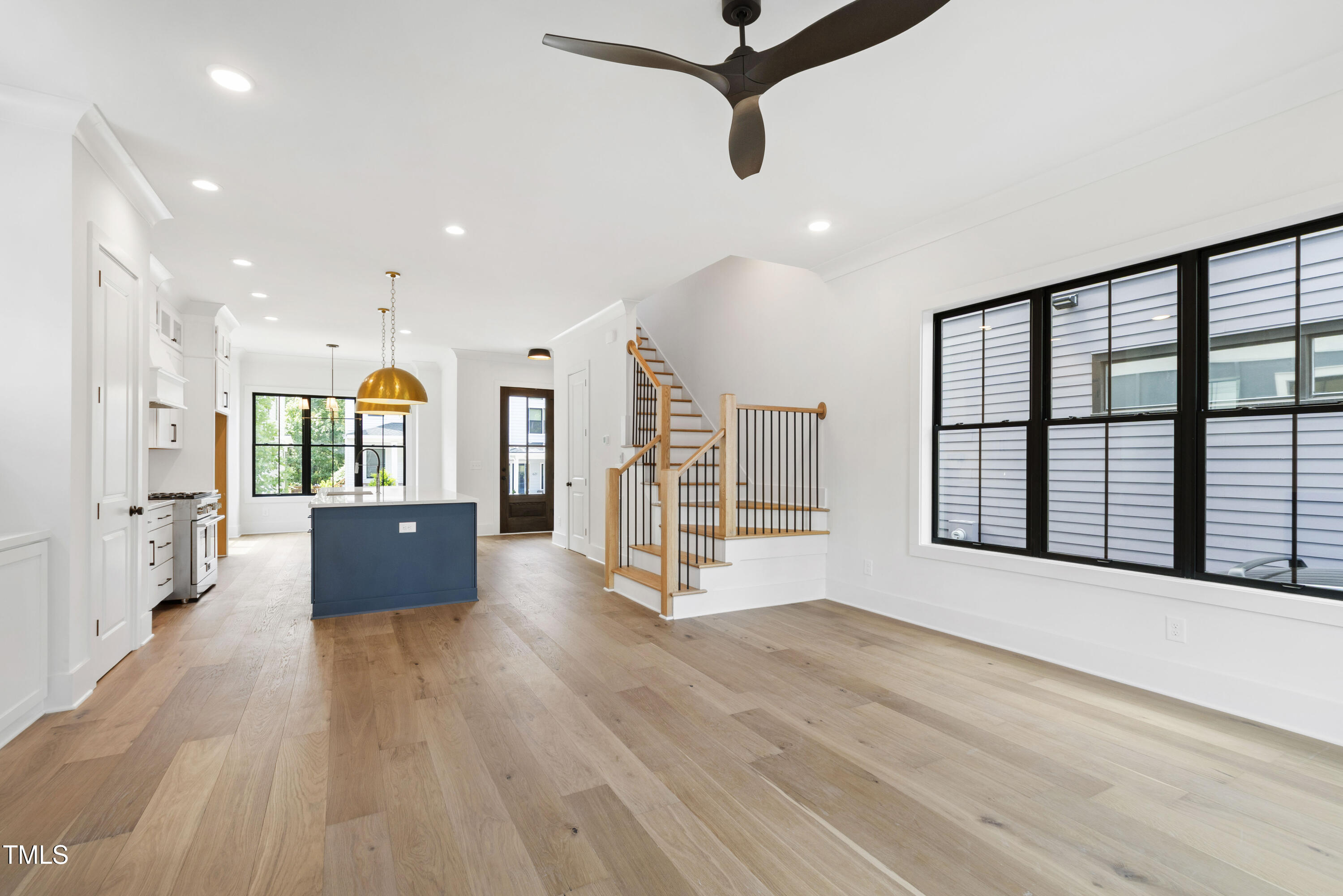 618 Velma Hopkins Lane Raleigh, NC 27603 - Photo 37 of 63 a view of a big room with wooden floor windows and a kitchen