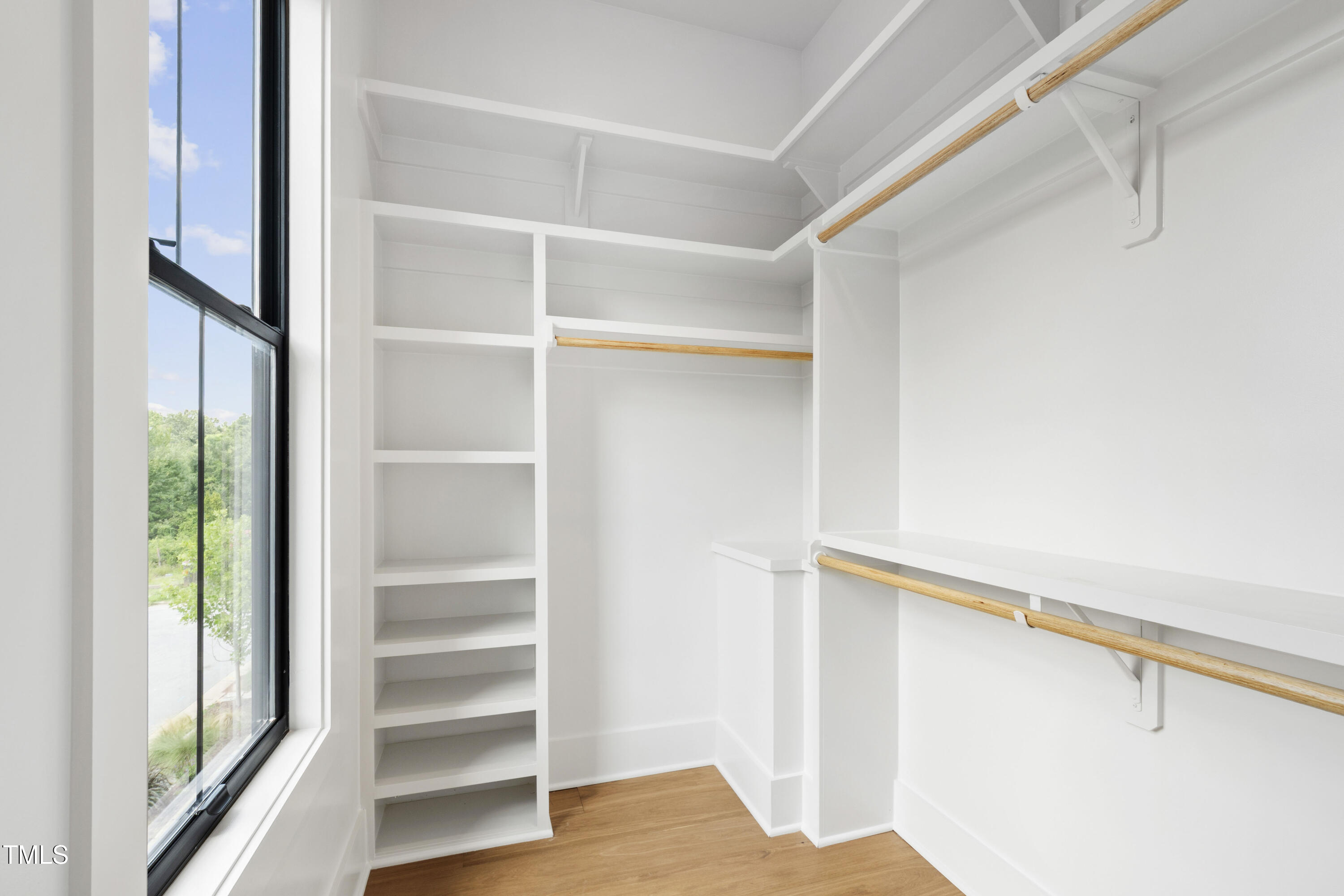 618 Velma Hopkins Lane Raleigh, NC 27603 - Photo 38 of 63 a view of walk in closet with empty racks