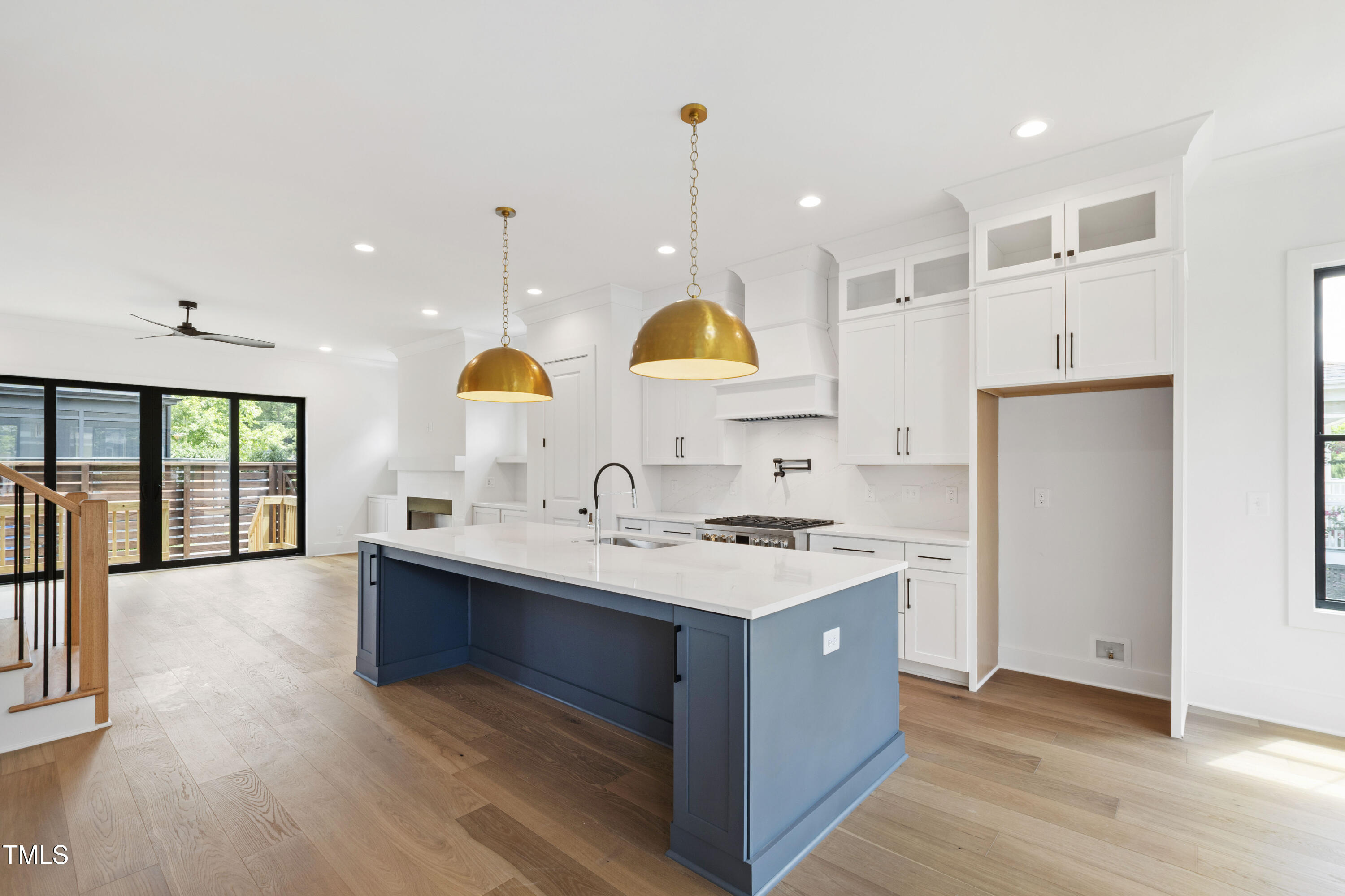 618 Velma Hopkins Lane Raleigh, NC 27603 - Photo 3 of 63 a kitchen with stainless steel appliances granite countertop a sink a stove and a wooden floor