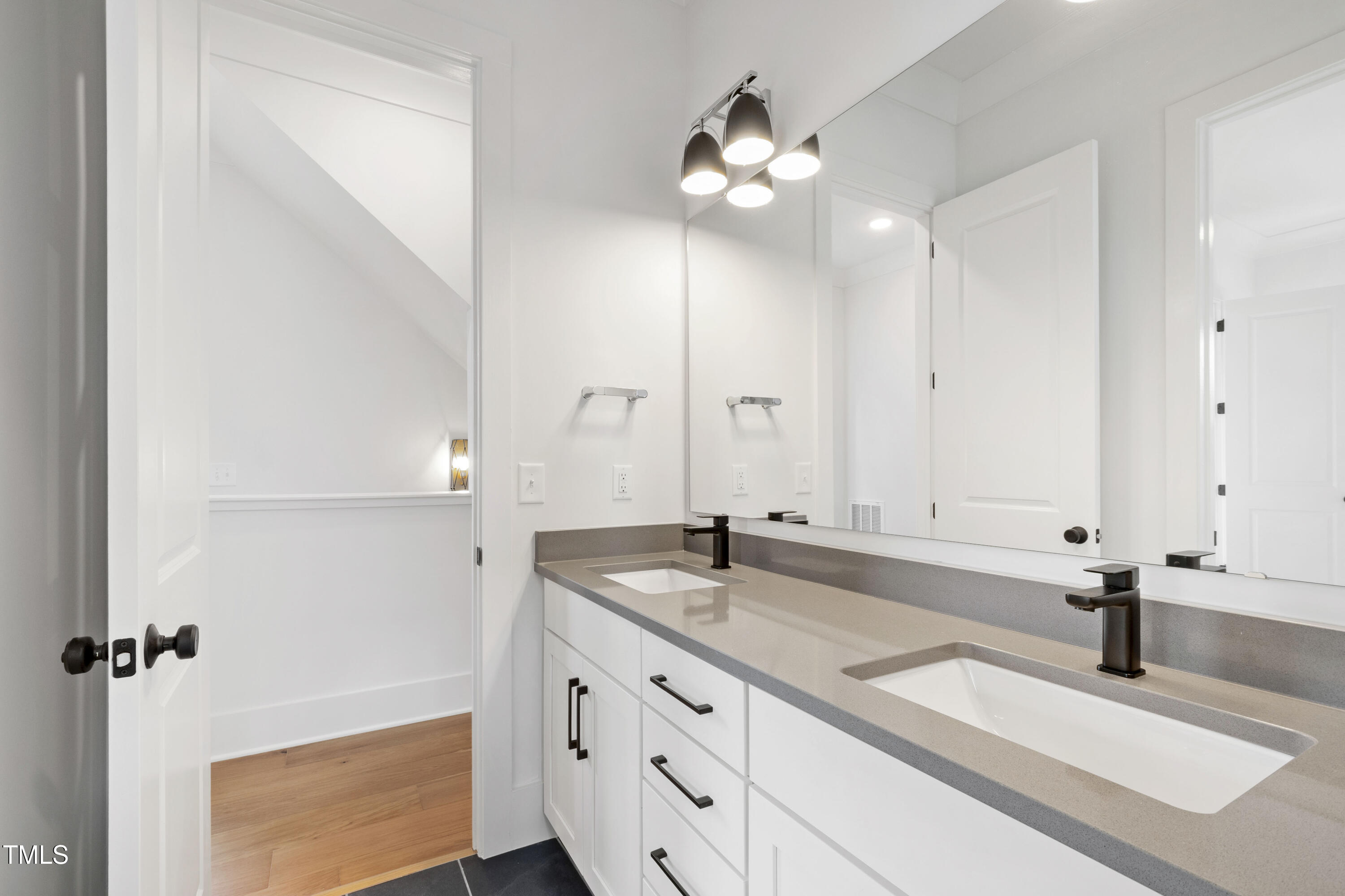 618 Velma Hopkins Lane Raleigh, NC 27603 - Photo 41 of 63 a bathroom with a sink and a mirror