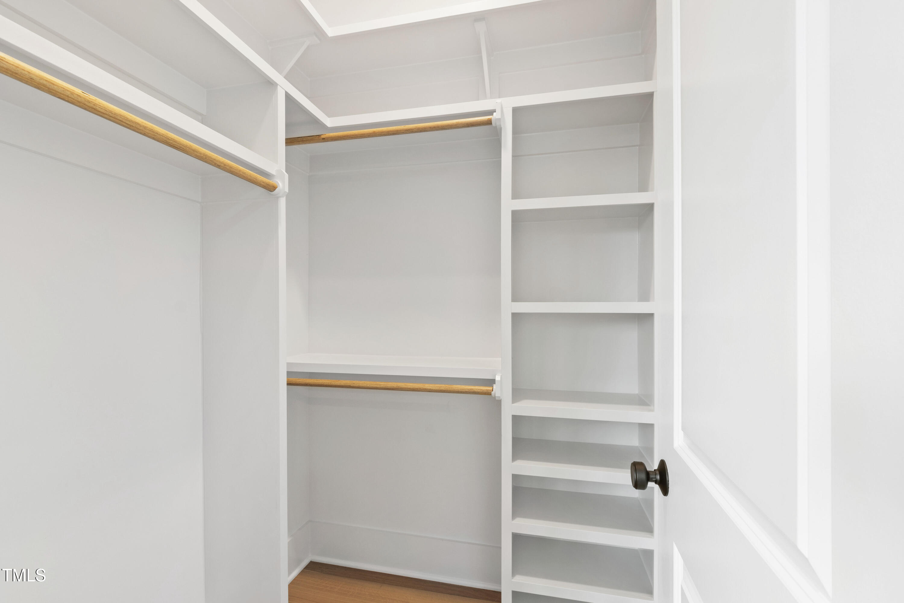 618 Velma Hopkins Lane Raleigh, NC 27603 - Photo 48 of 63 a view of walk in closet with empty racks