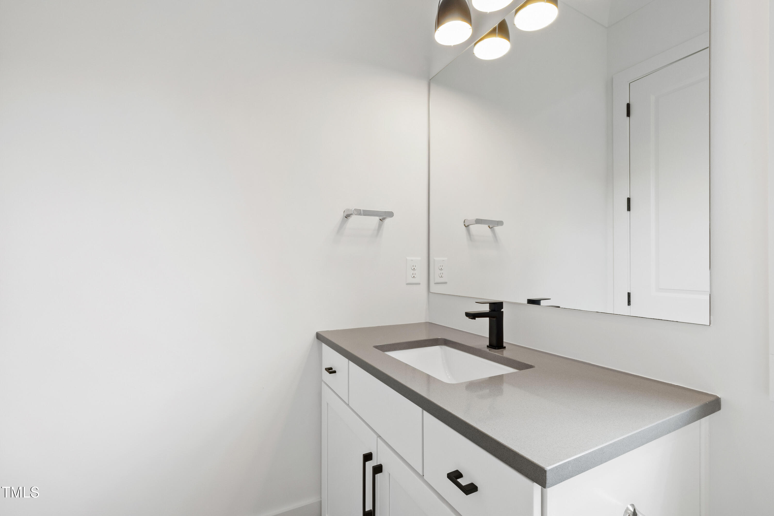 618 Velma Hopkins Lane Raleigh, NC 27603 - Photo 49 of 63 a bathroom with a sink and a mirror