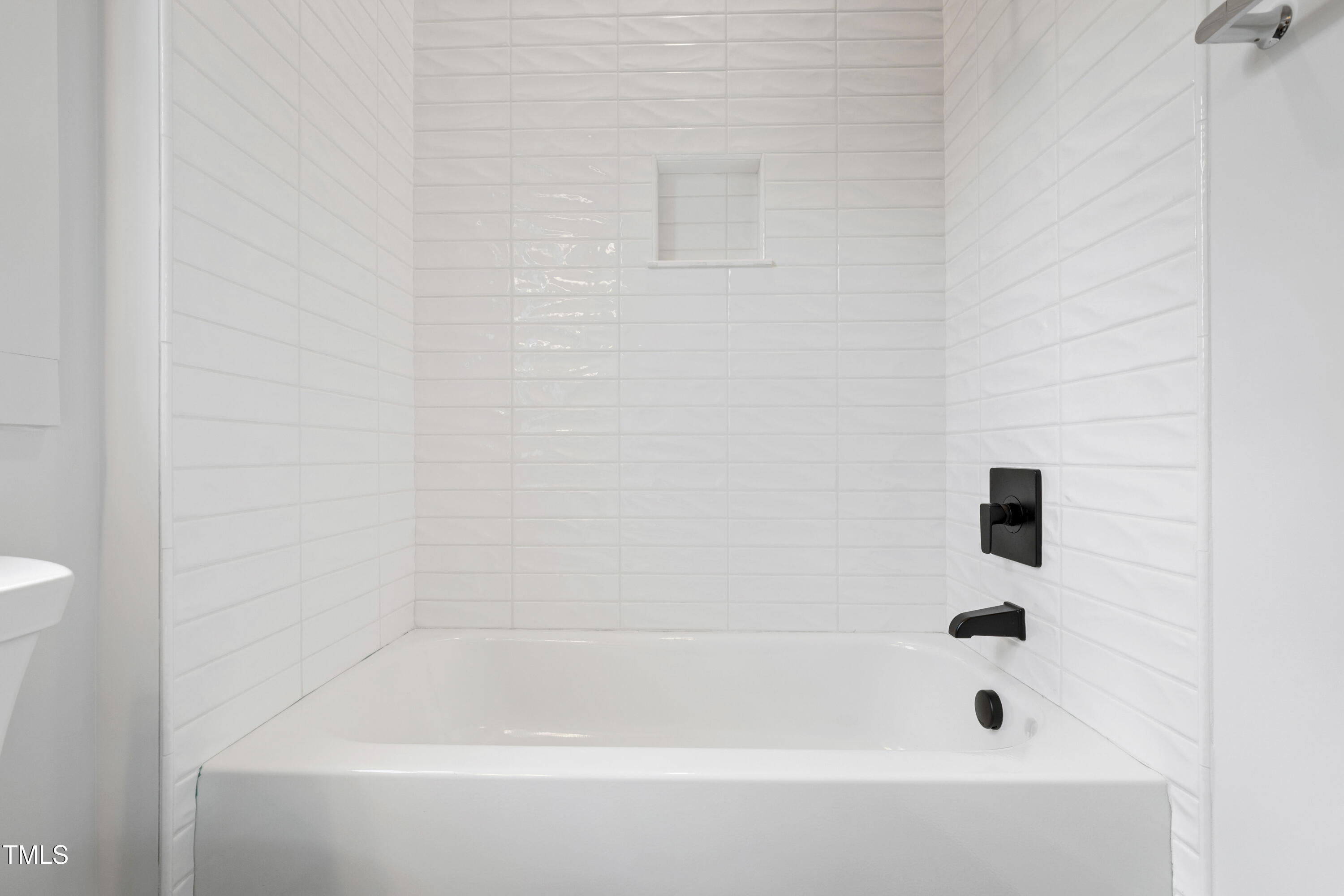 618 Velma Hopkins Lane Raleigh, NC 27603 - Photo 50 of 63 a bathroom with a bathtub