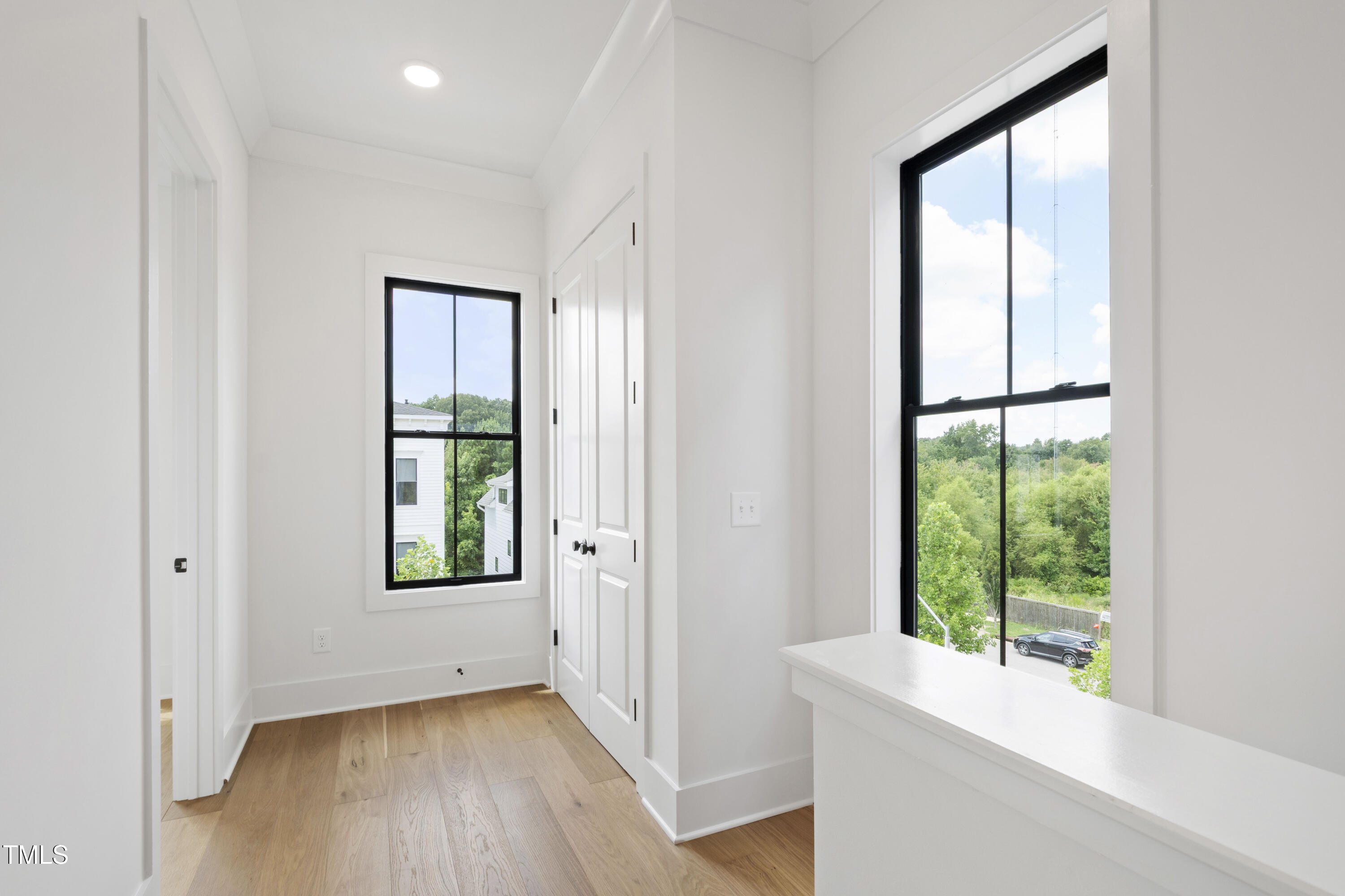 618 Velma Hopkins Lane Raleigh, NC 27603 - Photo 52 of 63 a view of an empty room with a window and wooden floor