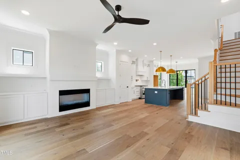 a view of an empty room with glass door and a balcony