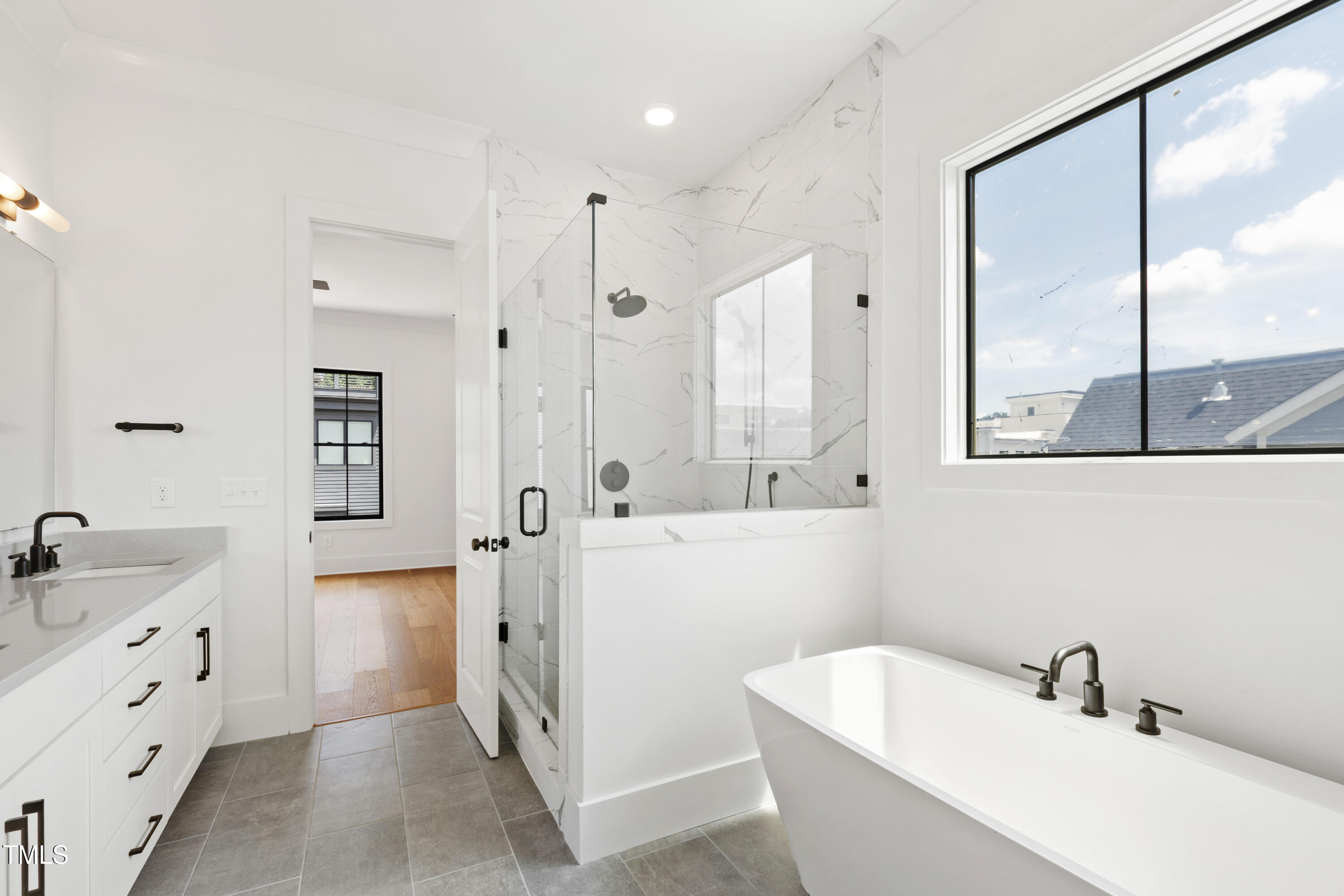 618 Velma Hopkins Lane Raleigh, NC 27603 - Photo 9 of 63 a bathroom with a tub sink and mirror