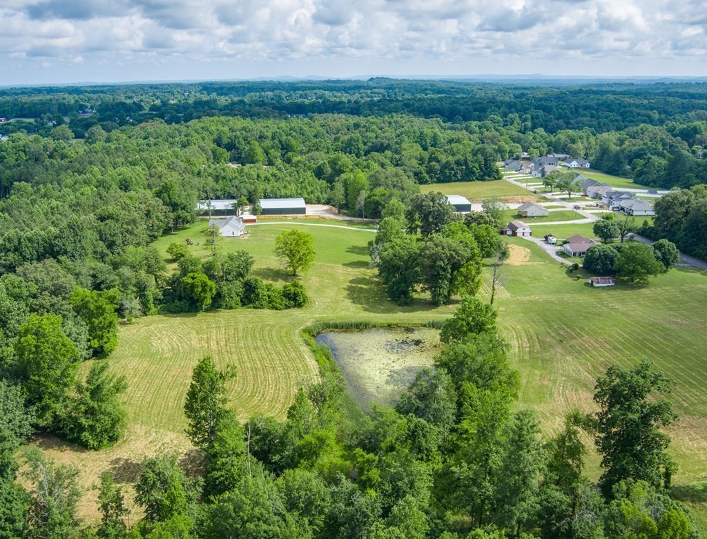 2390 Bowser Road Cookeville, TN 38506 - Photo 8 of 11 an aerial view of residential houses with outdoor space and trees